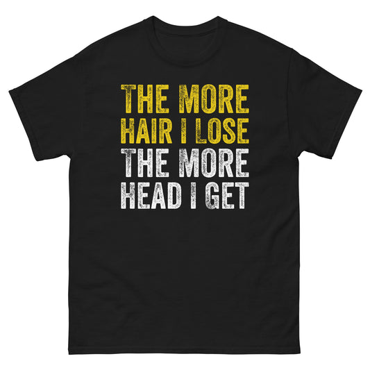 Black adult t-shirt with the text "The more hair I lose, the more head I get" in bold yellow and white print.