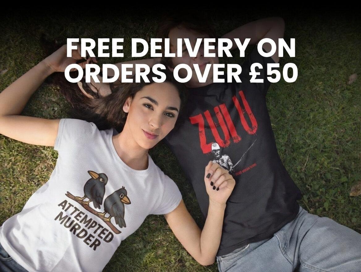 Two people lying on grass wearing t-shirts with text, promotional offer for free delivery on orders over £50.