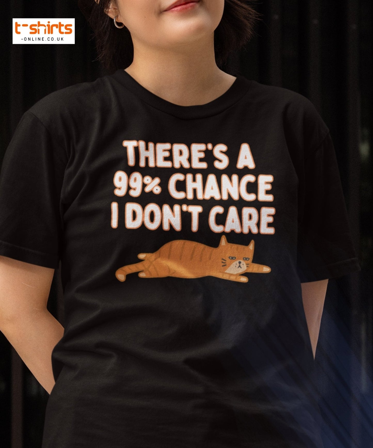 Person wearing a black t-shirt with a cat graphic and text 'THERE'S A 99% CHANCE I DON'T CARE'.