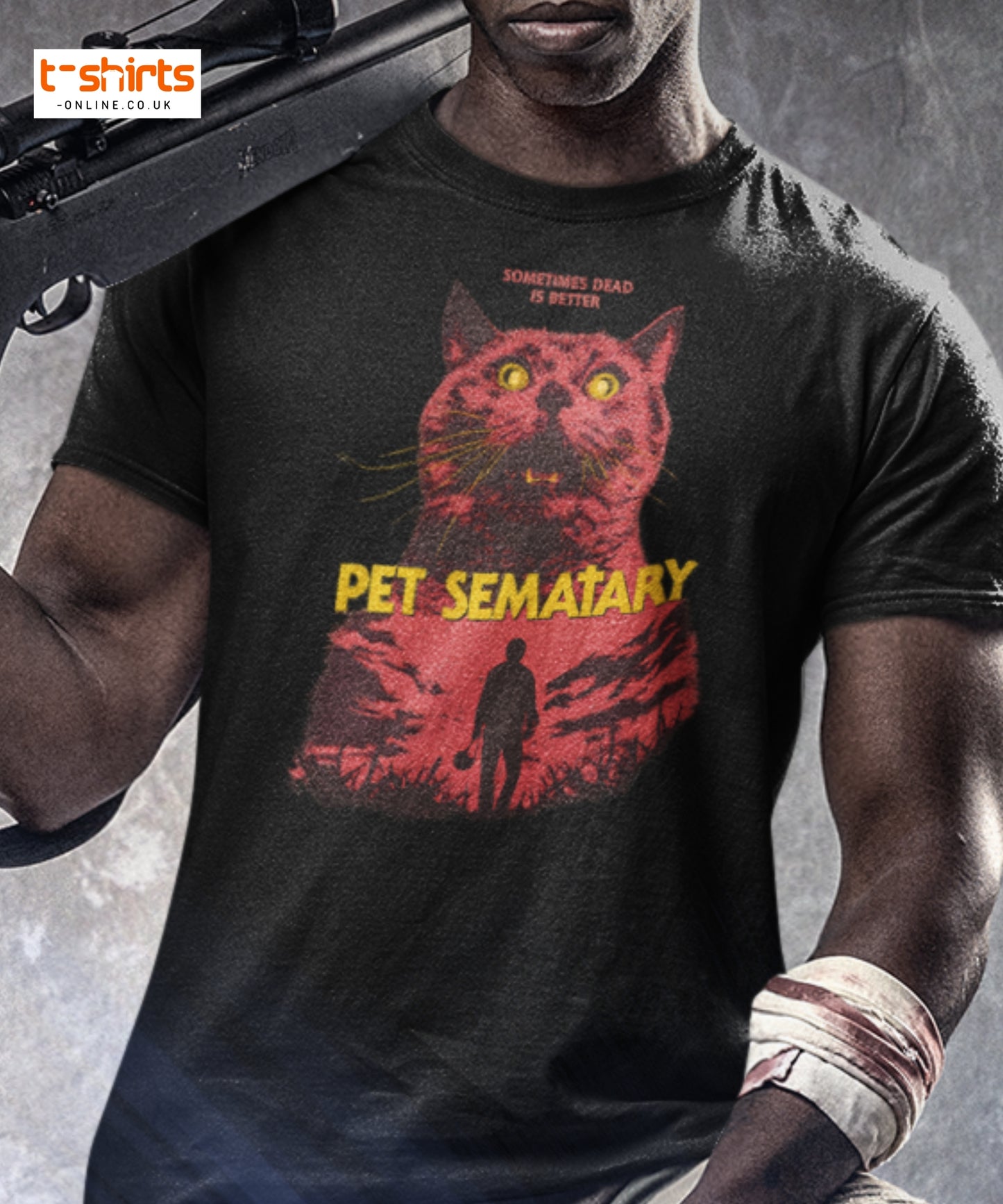 Person wearing a 'Pet Sematary' t-shirt with a red cat graphic and text.