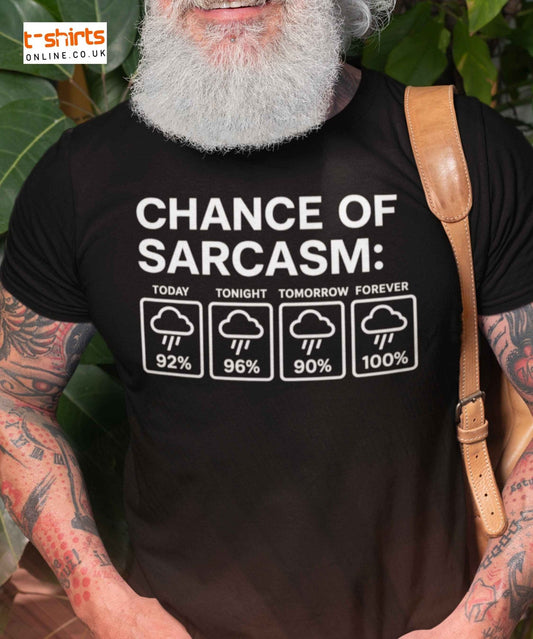 Man wearing a black t-shirt with 'Chance of Sarcasm' graphic, standing outdoors.