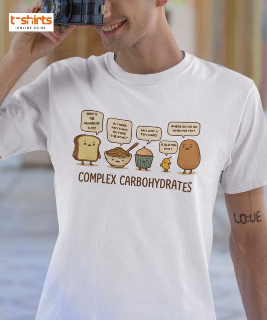 Person wearing a white t-shirt with cartoon food characters and text, with a blurred background.