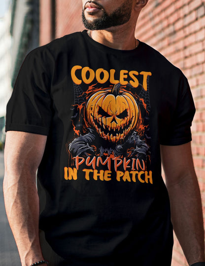 Man wearing a black t-shirt with a fiery jack-o'-lantern and the text “Coolest Pumpkin in the Patch.”