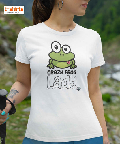 Person wearing a white t-shirt with a green frog graphic and text in an outdoor setting