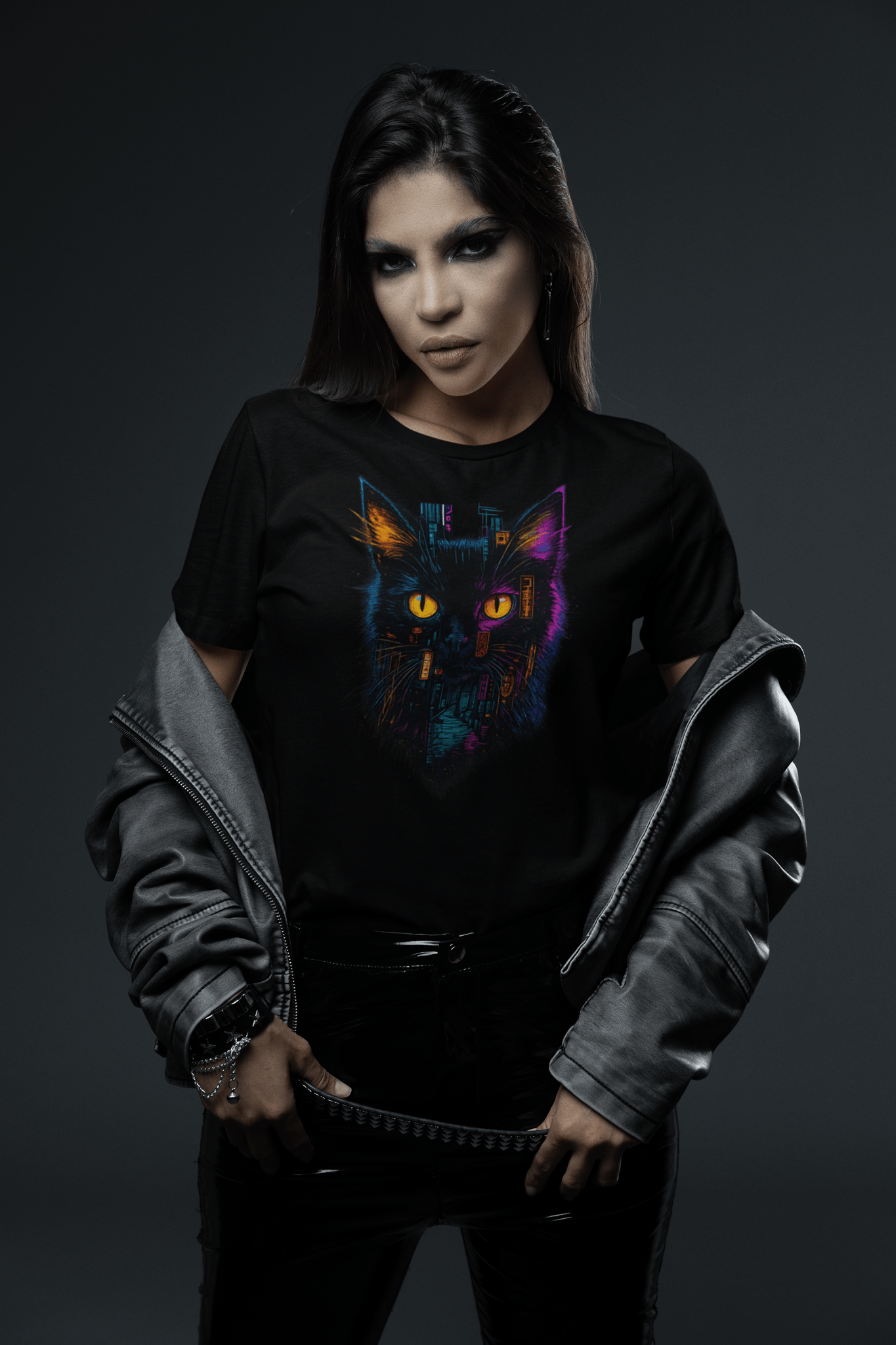 Person wearing a black sweatshirt with a colorful cat graphic on a dark background