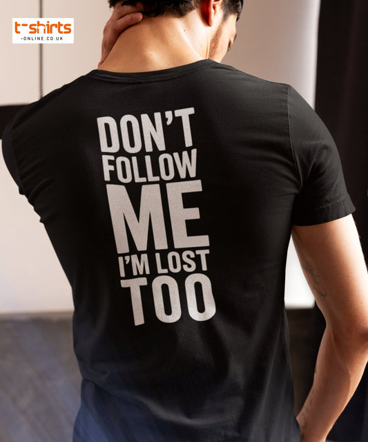Person wearing a black t-shirt with 'DON'T FOLLOW ME I'M LOST TOO' text on the back.