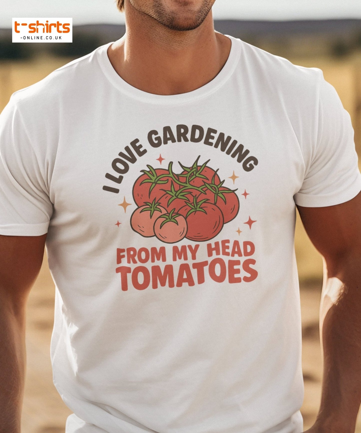 White t-shirt with tomato graphic and text worn by a person, set against a blurred outdoor background.