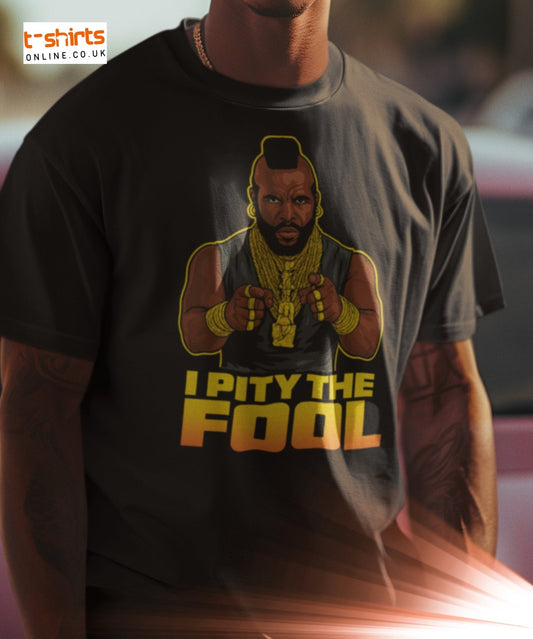 Man in a black t-shirt with a cartoon of a tough guy pointing and the phrase "I Pity The Fool" in bold yellow text.