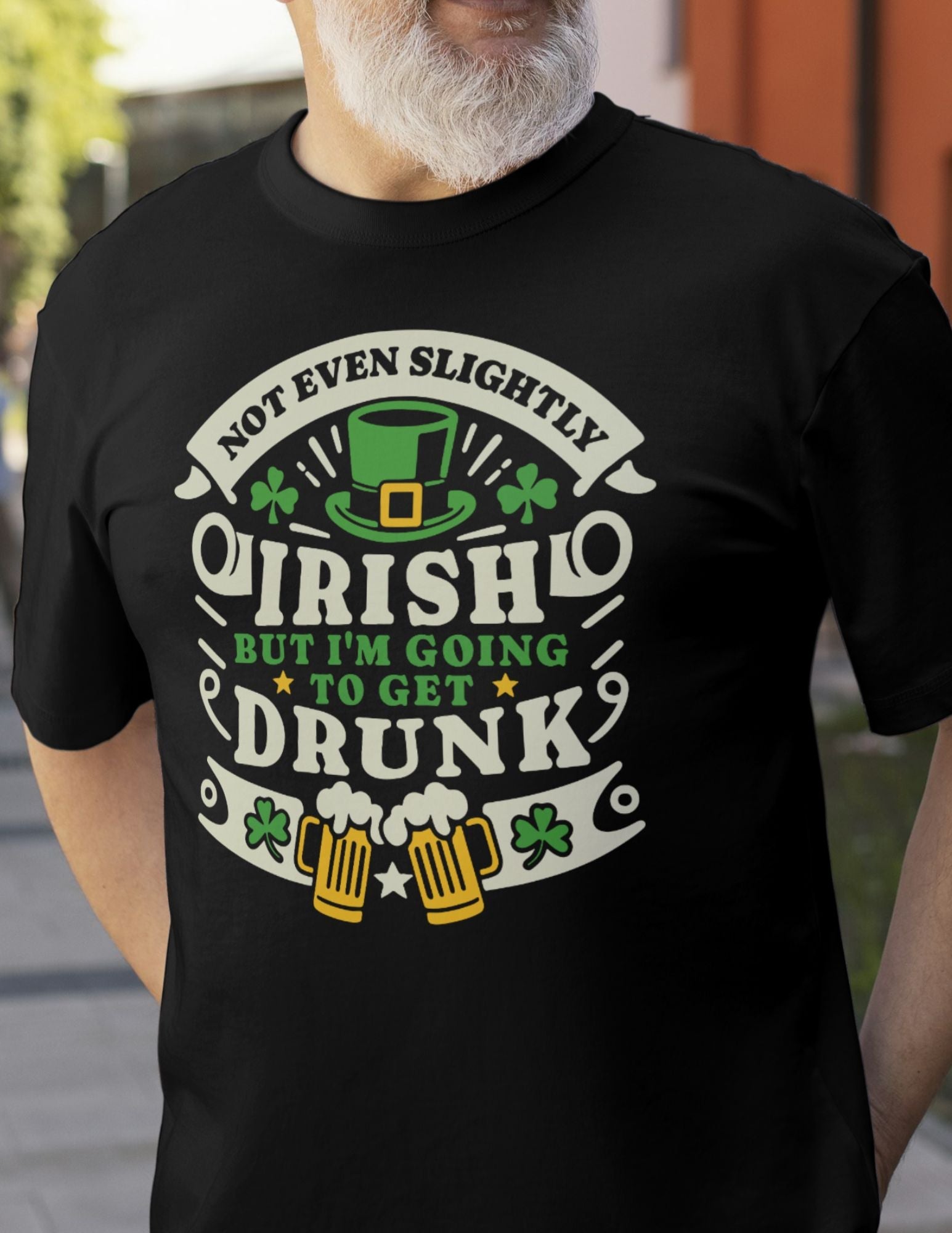 Black t-shirt with “Not Even Slightly Irish But I'm Going to Get Drunk” text, shamrocks, leprechaun hat, and beer mug design.