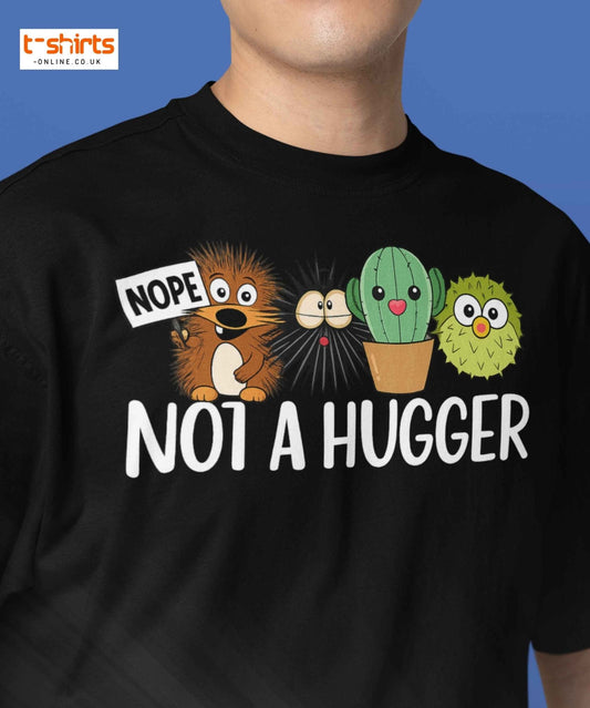 Black t-shirt with cartoon characters and text 'NOPE NOT A HUGGER' on a blue background