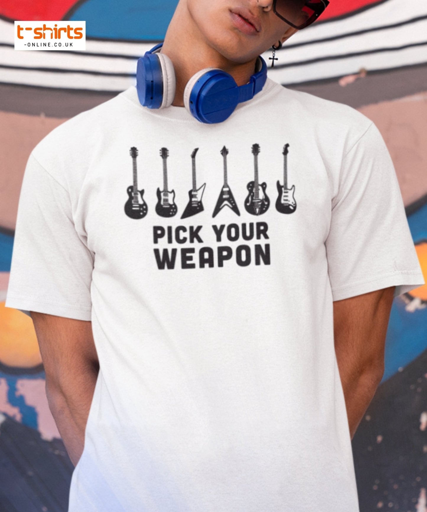 Person wearing a white t-shirt with guitar graphic and 'Pick Your Weapon' text, with colorful background.