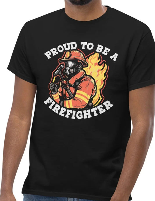 Black t-shirt featuring a bold firefighter graphic with flames and the text "Proud to Be a Firefighter"