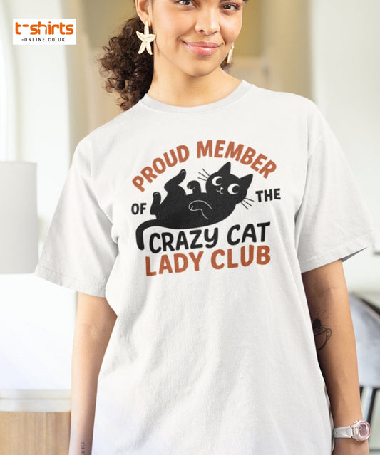 Woman wearing a white t-shirt with a cat-themed design and text.