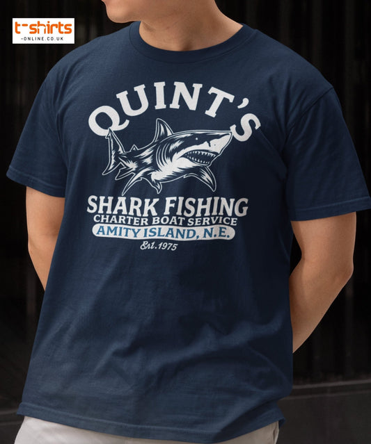 Navy blue t-shirt with shark fishing graphic and text worn by a person