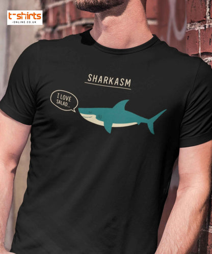 Black t-shirt with shark graphic and 'Sharkasm' text worn by a person.