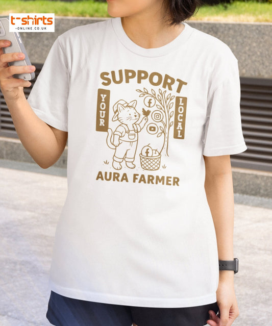 Person wearing a white t-shirt with a graphic design and text, standing outdoors.