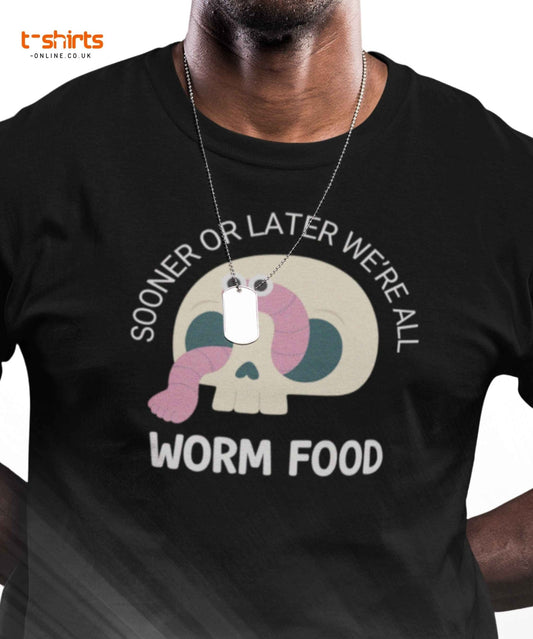 Black t-shirt with a graphic design featuring a skull and worm, text 'SOONER OR LATER WE'RE ALL WORM FOOD', and a brand logo in the corner.