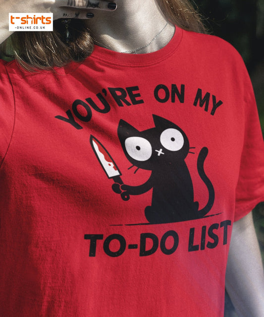 Red t-shirt with a black cat graphic and text 'You're on my to-do list' worn by a person.